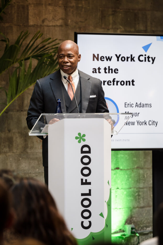 Mayor Eric Adams speaking at a Coolfood podium during Climate Week 2022